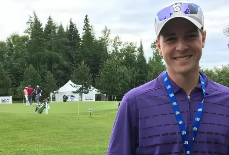 A portrait of Dustin Barr on a golf course