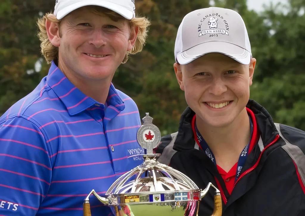 Dustin holds a trophy